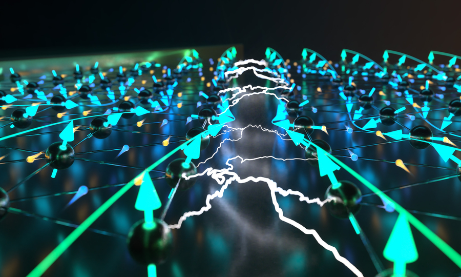 Illustration of a lattice with balls representing electrons. The balls have arrows showing magnetism, with electricity formed in between.